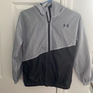 Under Armour light gray and black rain/ wind breaker jacket.  Size youth medium.